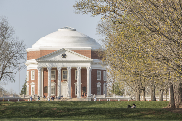 UVA Rotunda in Spring with students studying on the Lawn
